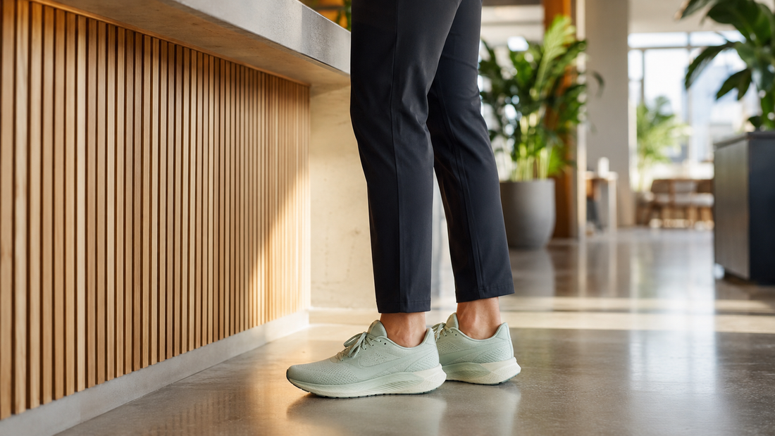 Unbranded cushioned running shoes being worn while standing at work
