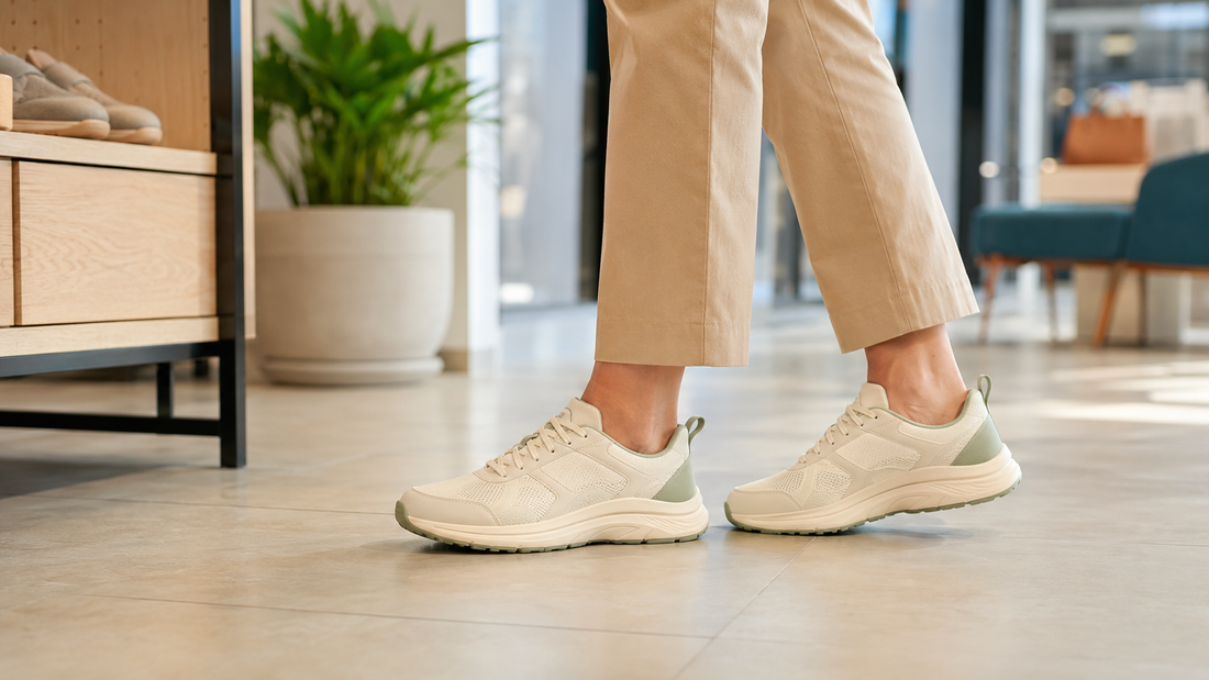 Unbranded walking shoes being worn while standing in a modern workspace